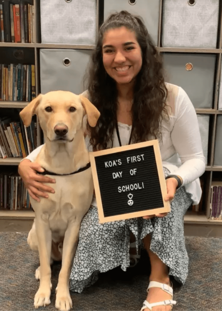 Alexis Flanders and her classroom dog, Koa